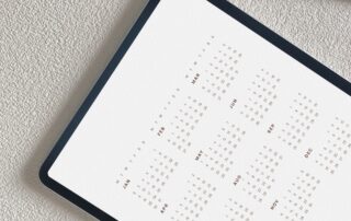 Calendar view on a tablet with a pencil next to it